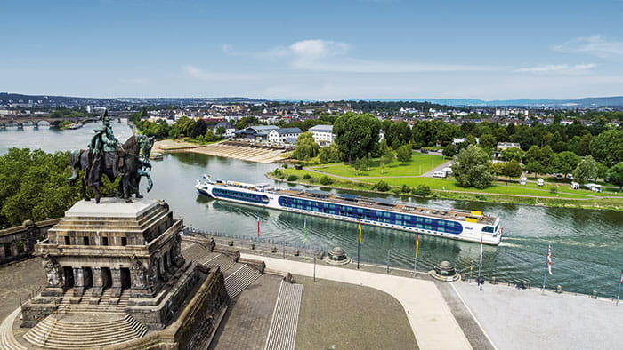 Spirit of the Rhine sailing past Deutsches Eck in Koblenz, Germany